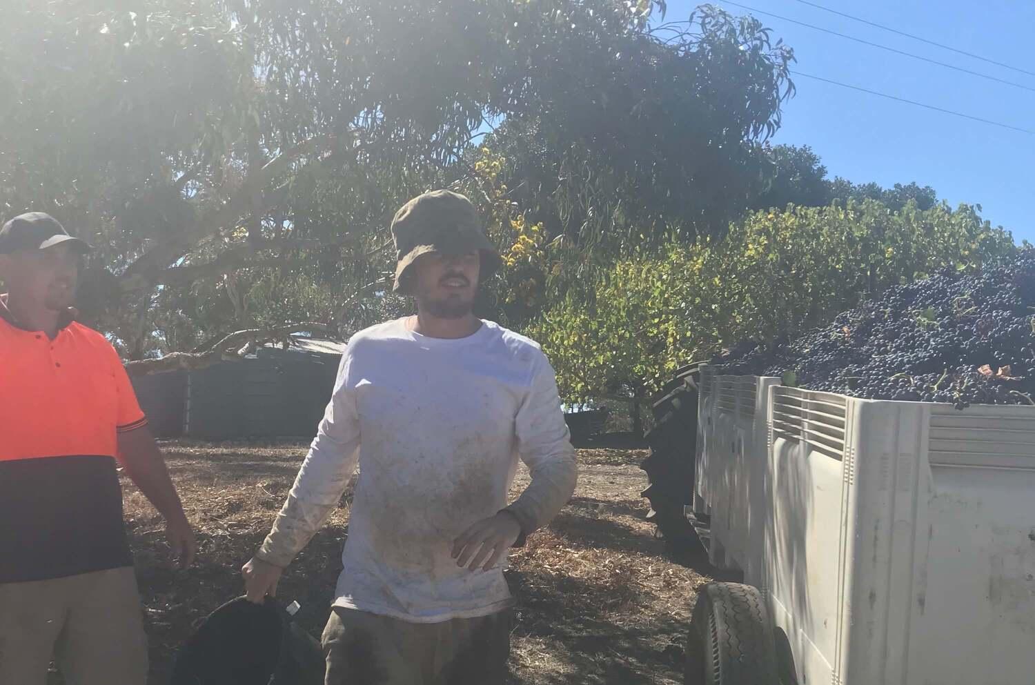 Backpacker James Short smiling while working on a farm